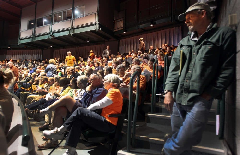 Back in 2013, hundreds of people fill the Hanaway Theatre at Plymouth State University during a public hearing before the U.S. Department of Energy on the Northern Pass project. (Jim Cole/AP)