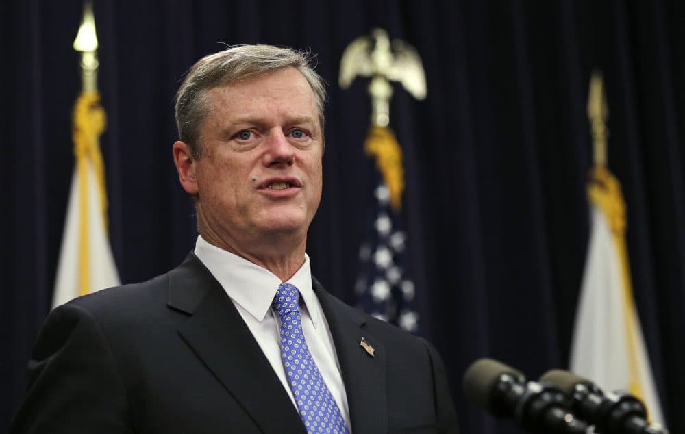 Gov. Charlie Baker speaks with reporters at the State House in Boston in 2015. (Charles Krupa/AP)