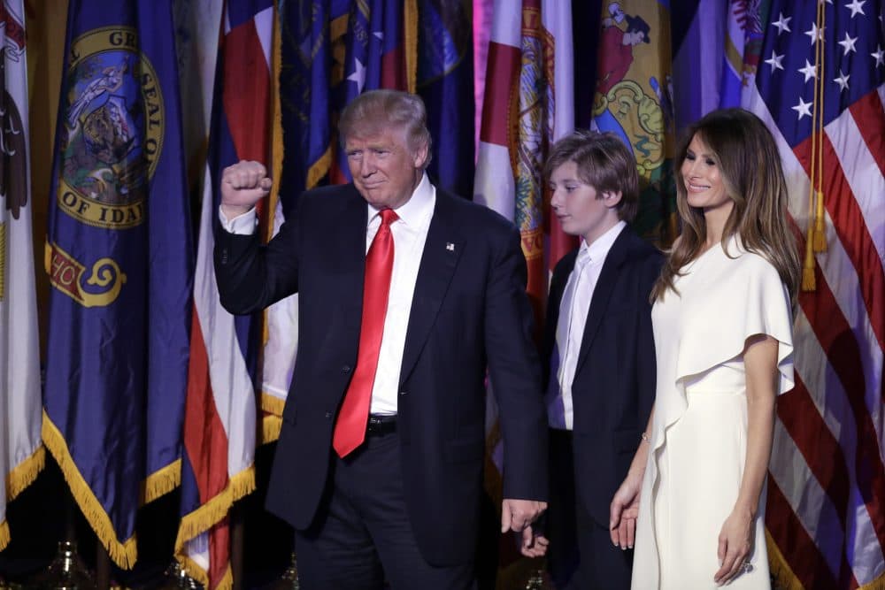 President-elect Donald Trump pumps his fist after giving his acceptance speech on Nov. 9, 2016 in New York, with his wife Melania Trump, right, and their son Barron follow him. (John Locher/AP)