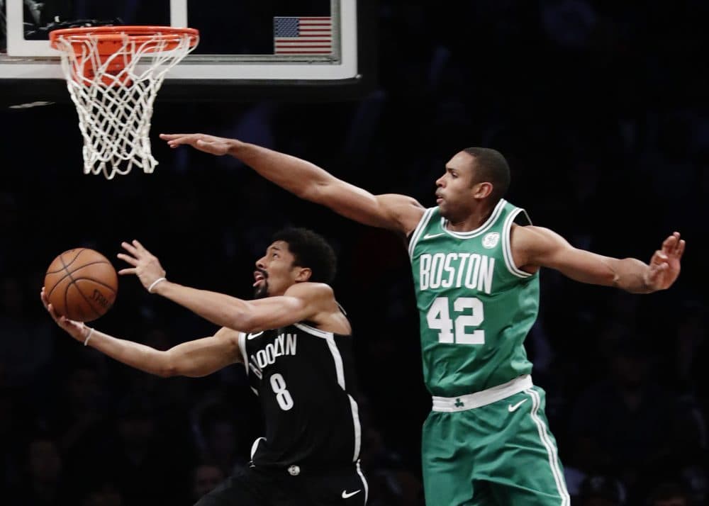 Brooklyn Nets' Spencer Dinwiddie (8) drives past Boston Celtics' Al Horford (42) during the second half of an NBA basketball game Tuesday, Nov. 14, 2017, in New York. The Celtics won 109-102. (AP Photo/Frank Franklin II)