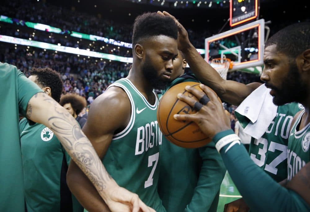 Boston Celtics' Kyrie Irving, right, gives the ball to teammate Jaylen Brown (7) after defeating the Golden State Warriors 92-88 during an NBA basketball game in Boston, Thursday, Nov. 16, 2017. (AP Photo/Michael Dwyer)