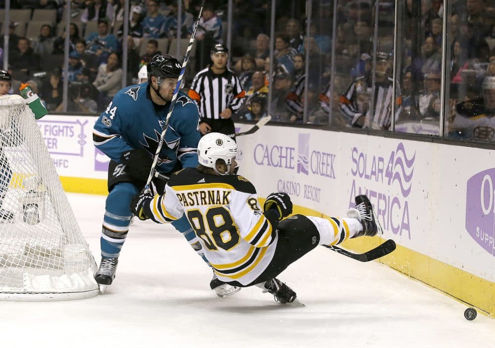Boston Bruins right wing David Pastrnak (88), of the Czech Republic, collides with San Jose Sharks defenseman Marc-Edouard Vlasic (44) during the first period of an NHL hockey game Saturday, Nov. 18, 2017, in San Jose, Calif. (AP Photo/Tony Avelar)