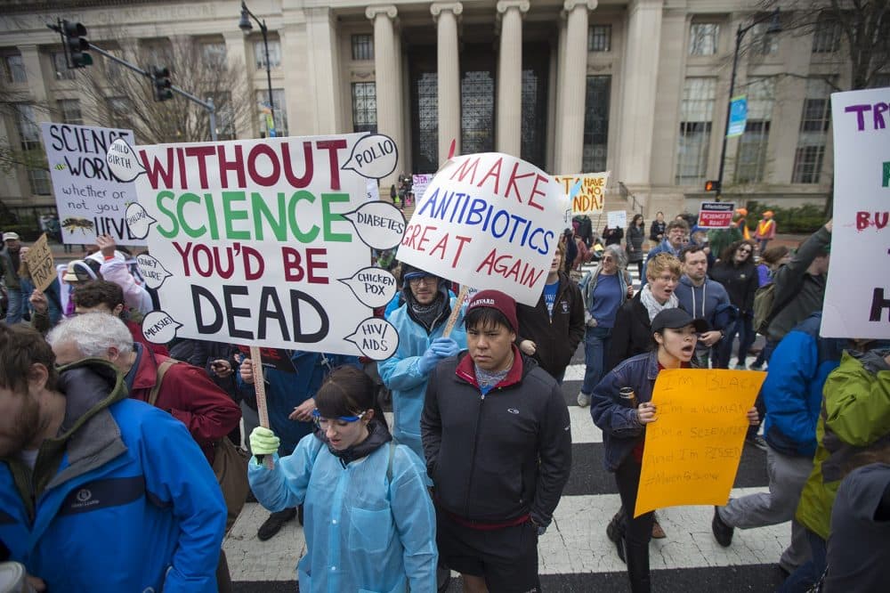 Harvard students, faculty and alumni arrive to meet with MIT protesters to continue thier march to the Boston Common for the March for Science Rally. (Jesse Costa/WBUR)