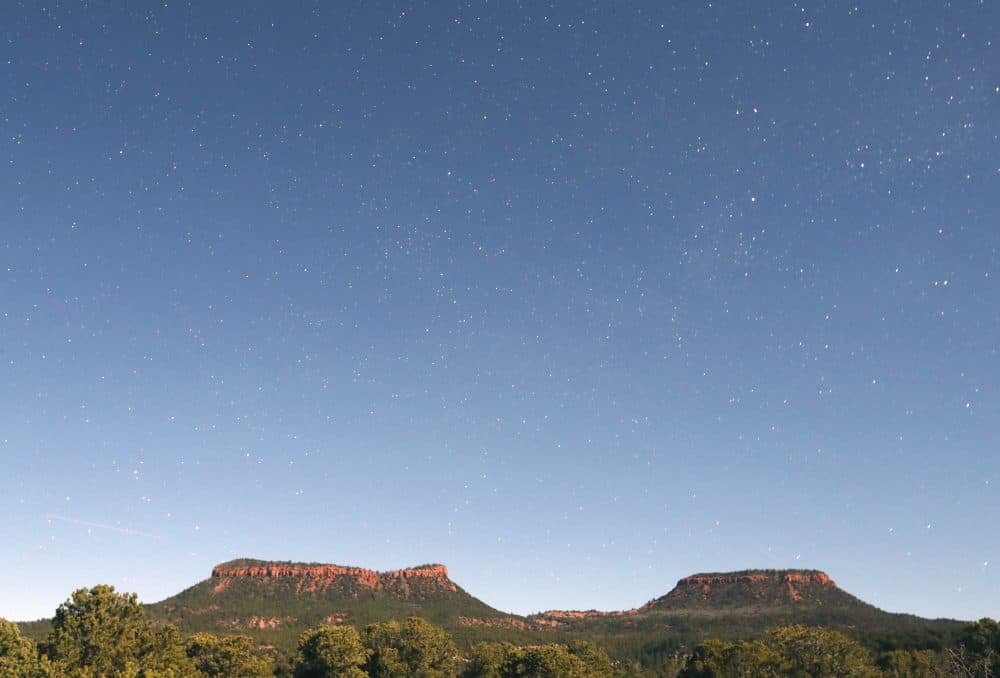 This time-exposed photo taken at midnight shows the stars and the two bluffs known as the &quot;Bears Ears&quot; in the Bears Ears National Monument on May 12, 2017, outside Blanding, Utah. (George Frey/Getty Images)