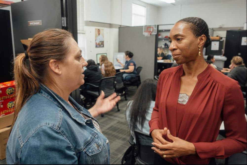 Clinical psychologist Miatta Snetter (right) speaks to Marine Corps veteran Sherry Pope at the Fullerton College Veterans Resource Center. Snetter says woman sometimes feel uncomfortable around male veterans at the VA. (Libby Denkmann/American Homefront Project)