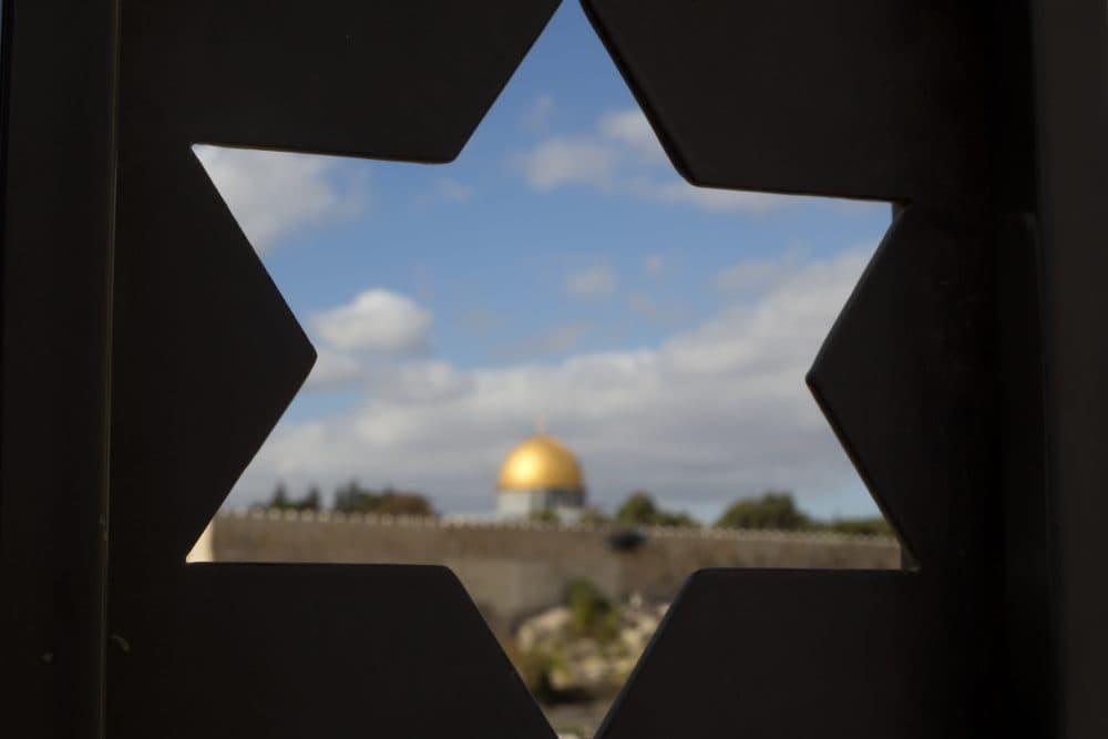 The Dome of the Rock Mosque in the Al Aqsa Mosque compound in Jerusalem's Old City is seen trough a door with the shape of star of David, Thursday, Dec. 7, 2017, a day after President Trump's recognition of Jerusalem as Israel's capital. (Ariel Schalit/AP)
