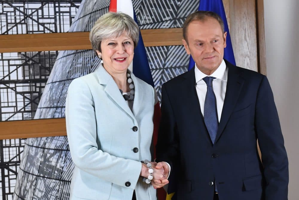 British Prime Minister Theresa May is welcomed by European Council President Donald Tusk at the European Council in Brussels on Dec. 8, 2017. (Emmanuel Dunand/AFP/Getty Images)