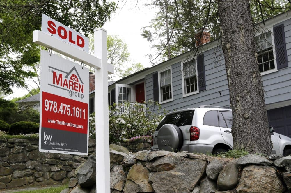 In this May 24, 2016 file photo, a &quot;Sold&quot; sign is placed front of a house in Andover, Mass. (Elise Amendola/AP)