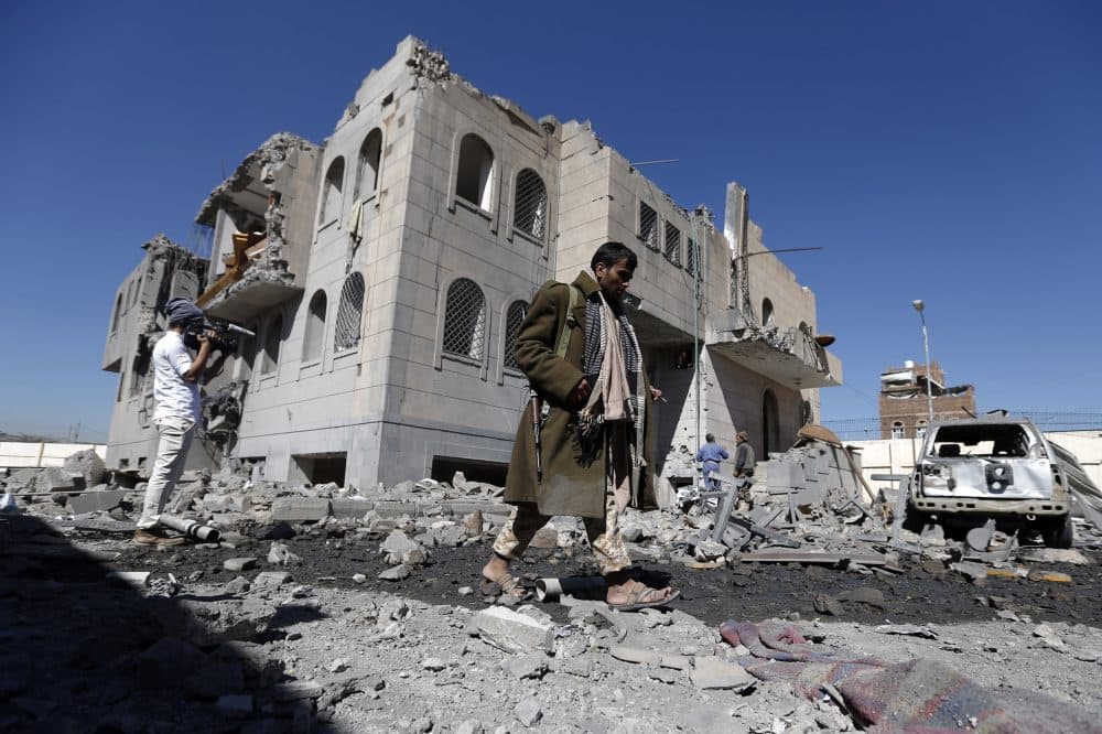 Yemenis check the site of airstrikes at a Houthi-run detention center in the capital Sanaa on Dec. 13, 2017. (Mohammed Huwais/AFP/Getty Images)