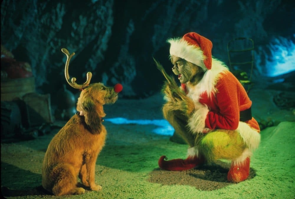 The Grinch, played by Jim Carrey, conspires with his dog Max to deprive the Whos of their favorite holiday in the live-action adaptation &quot;Dr. Seuss' How The Grinch Stole Christmas.&quot; (Getty Images)