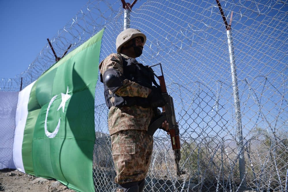 A Pakistani soldier keeps vigil next to a newly fenced border fencing along with Afghan's Paktika province border in Angoor Adda in Pakistan's South Waziristan tribal agency on Oct. 18, 2017. (Aamir Qureshi/AFP/Getty Images)