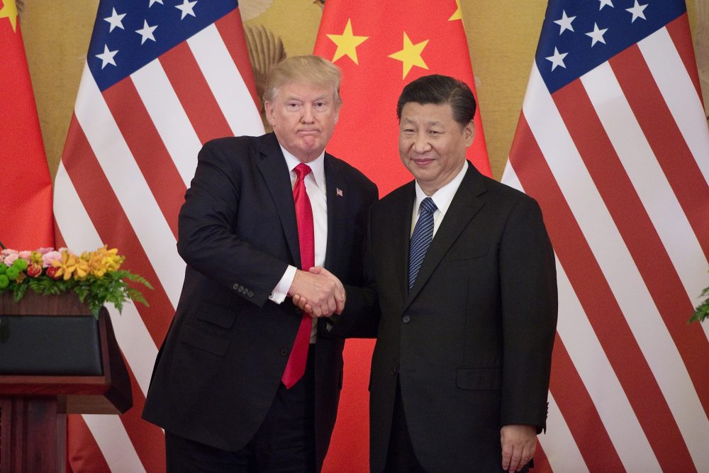 President Trump shakes hands with China's President Xi Jinping during a press conference at the Great Hall of the People in Beijing on Nov. 9, 2017. (Nicolas Asfouri/AFP/Getty Images)