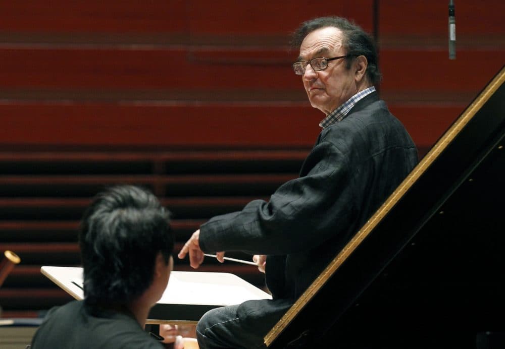 In this October, 2011 photo, world-renowned conductor Charles Dutoit performs with the Philadelphia Orchestra during a rehearsal. (Alex Brandon/AP)