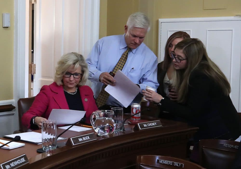 House Rules Committee Chairman Pete Sessions (R-Texas) (center), talks with staffers as Rep. Liz Cheney (R-Wyo.) (left) sits nearby as negotiations continue on funding the government to avert a shutdown at midnight on Friday night, at the U.S. Capitol on Dec. 21, 2017 in Washington, D.C. (Mark Wilson/Getty Images)