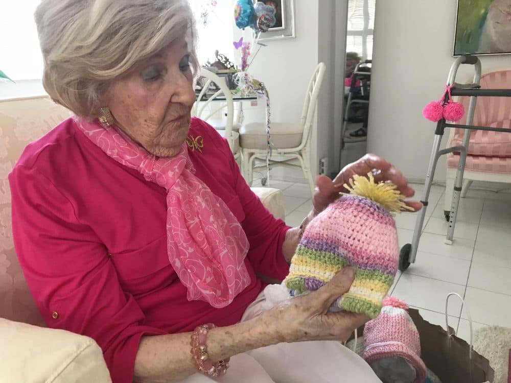 Mazie Ford's knitted hats for newborns are &quot;like snowflakes,&quot; her daughter said. No two ever look alike. (Caitie Switalski/WLRN)
