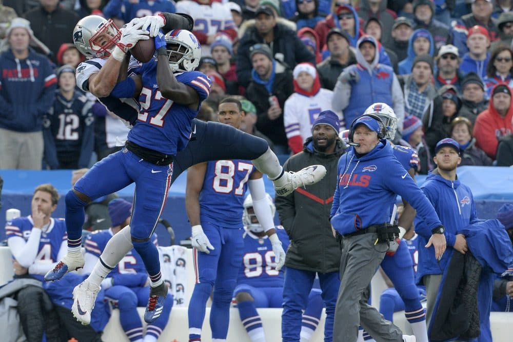 New England Patriots tight end Rob Gronkowski, left, makes a catch as Buffalo Bills cornerback Tre'Davious White (27) defends during the second half of an NFL football game, Sunday, Dec. 3, 2017, in Orchard Park, N.Y. Bills head coach Sean McDermott, right, looks on during the play. (Adrian Kraus/AP)