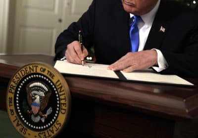 President Donald Trump signs a proclamation to recognize Jerusalem as the capital of Israel in the Diplomatic Reception Room of the White House, Wednesday, Dec. 6, 2017, in Washington. Trump recognized Jerusalem as Israel's capital despite intense Arab, Muslim and European opposition to a move that would upend decades of U.S. policy and risk potentially violent protests. (Evan Vucci/AP)