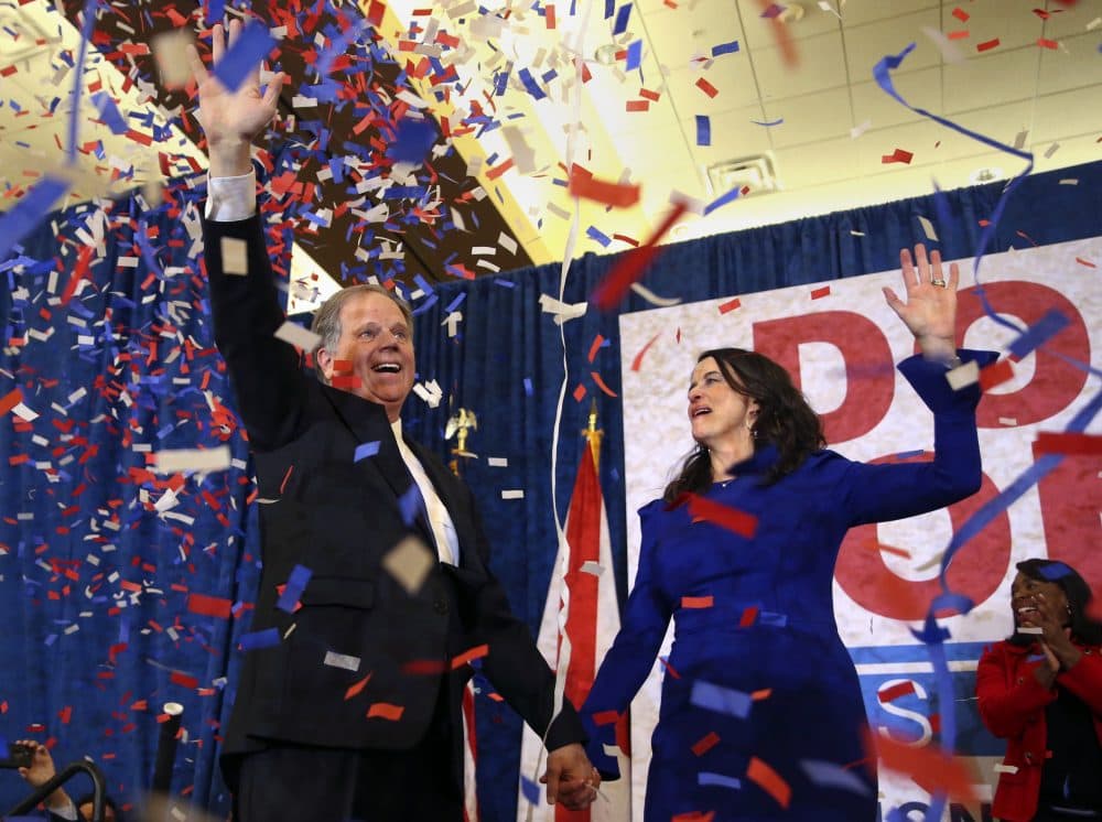 Democratic candidate for U.S. Senate Doug Jones and his wife Louise wave to supporters before speaking Tuesday, Dec. 12, 2017, in Birmingham, Ala. Jones has defeated Republican Roy Moore, a one-time GOP pariah who was embraced by the Republican Party and the president even after facing allegations of sexual impropriety. (John Bazemore/AP)