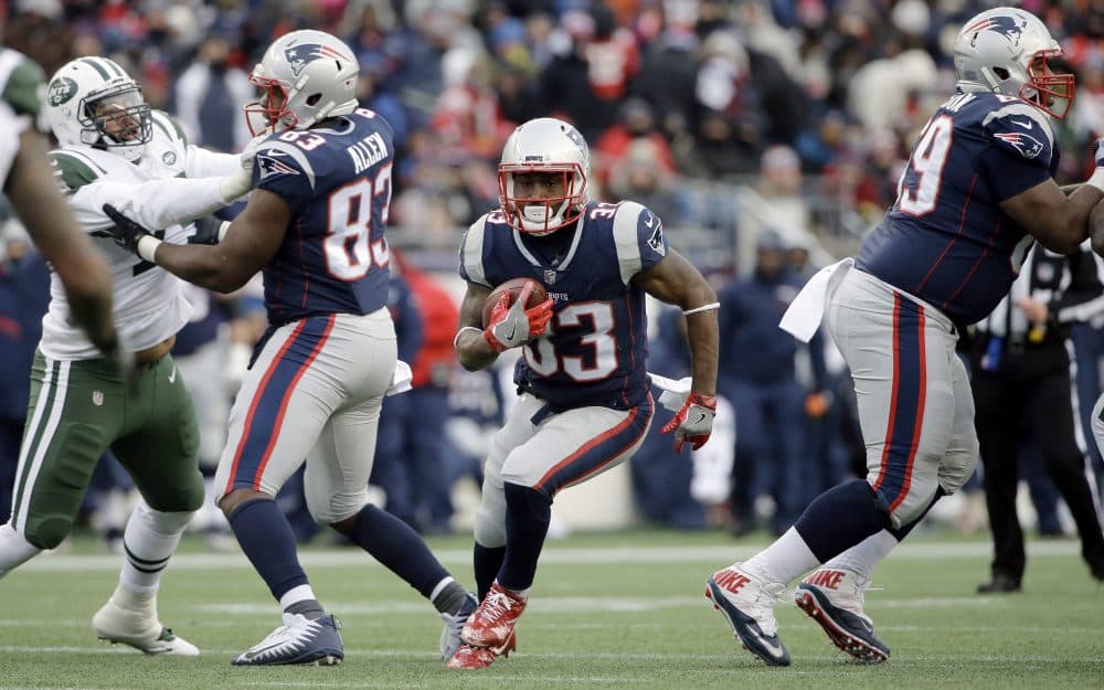 New England Patriots running back Dion Lewis (33) gains yardage against the New York Jets during the second half of an NFL football game, Sunday, Dec. 31, 2017, in Foxborough, Mass. (AP Photo/Steven Senne)