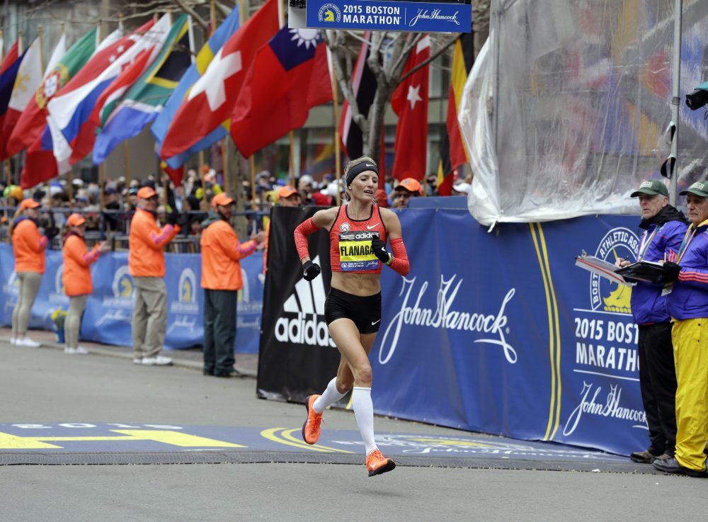 Shalane Flanagan crosses the finish line of the 2015 Boston Marathon. (Elise Amendola/AP)