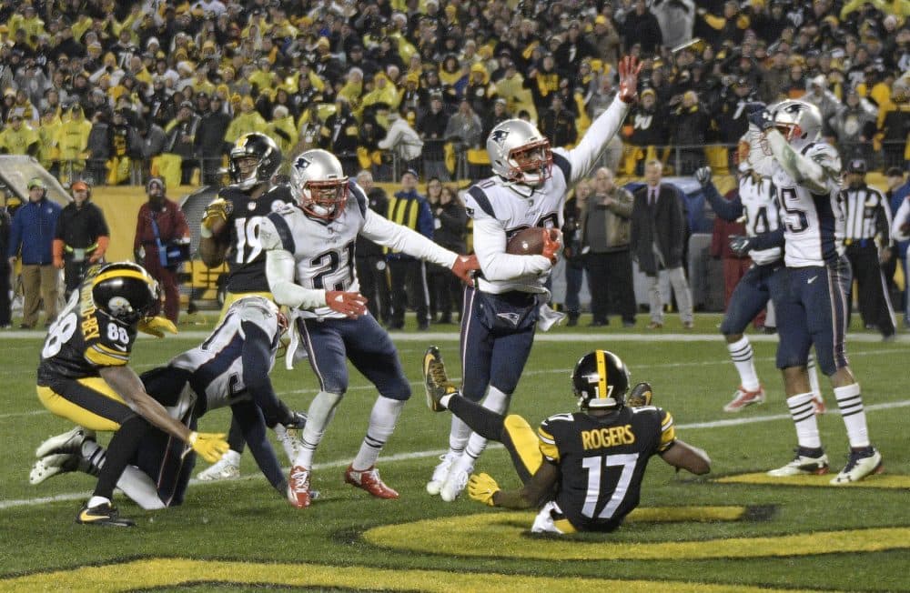 New England Patriots strong safety Duron Harmon, center, celebrates his interception in the end zone of a pass from Pittsburgh Steelers quarterback Ben Roethlisberger (7) during the second half of an NFL football game in Pittsburgh, Sunday, Dec. 17, 2017. The Patriots won 27-24. (AP Photo/Keith Srakocic)