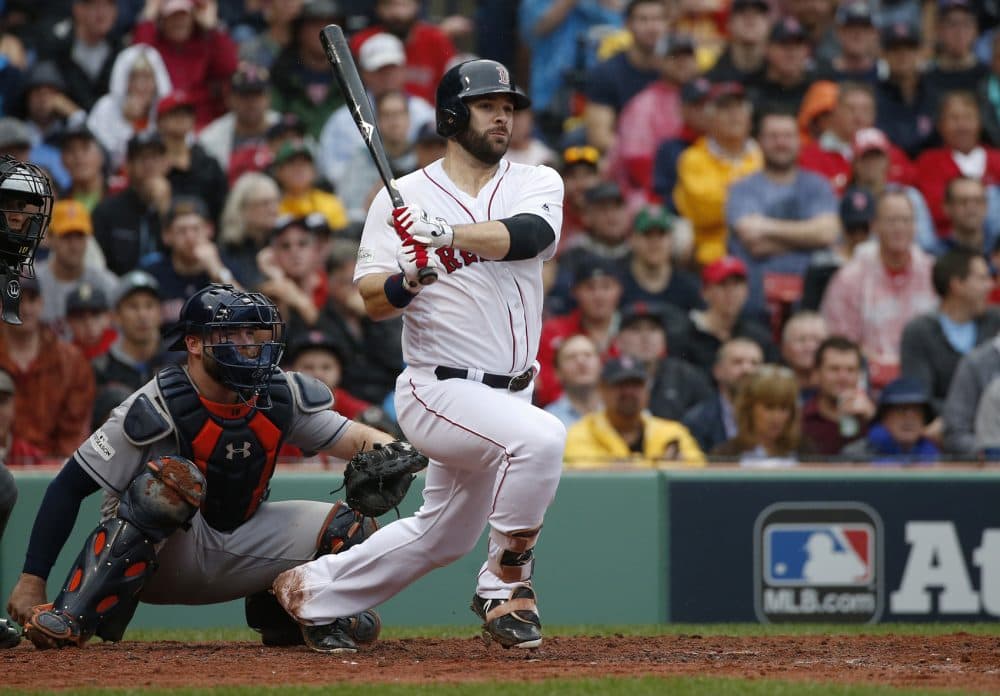 Boston Red Sox's Mitch Moreland hits a double during the third inning in Game 4 of baseball's American League Division Series against the Houston Astros, Monday, Oct. 9, 2017, in Boston. (AP Photo/Michael Dwyer)