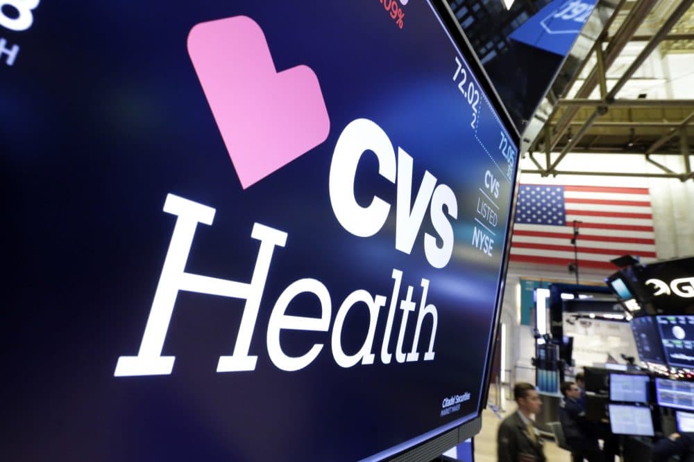 The CVS Health logo appears above a trading post on the floor of the New York Stock Exchange on Monday. (Richard Drew/AP)