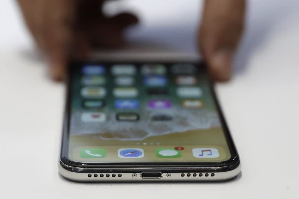 The new iPhone X is displayed on Sept. 12 in Cupertino, Calif. (Marcio Jose Sanchez/AP)