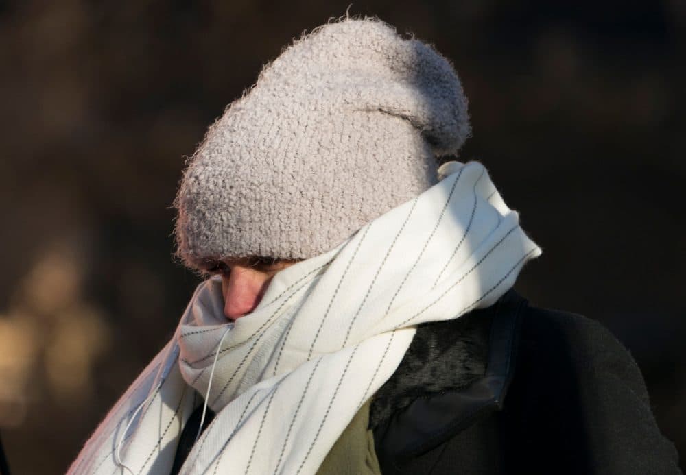 A woman walks down 50th Street bundled against the cold on Dec. 28, 2017 in New York, as a bitter Arctic chill settled across much of the United States and Canada. (Don Emmert/AFP/Getty Images)