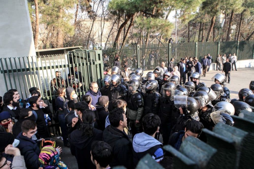 Iranian students scuffle with police at the University of Tehran during a demonstration driven by anger over economic problems, in the capital Tehran on Dec. 30, 2017. (STR/AFP/Getty Images)