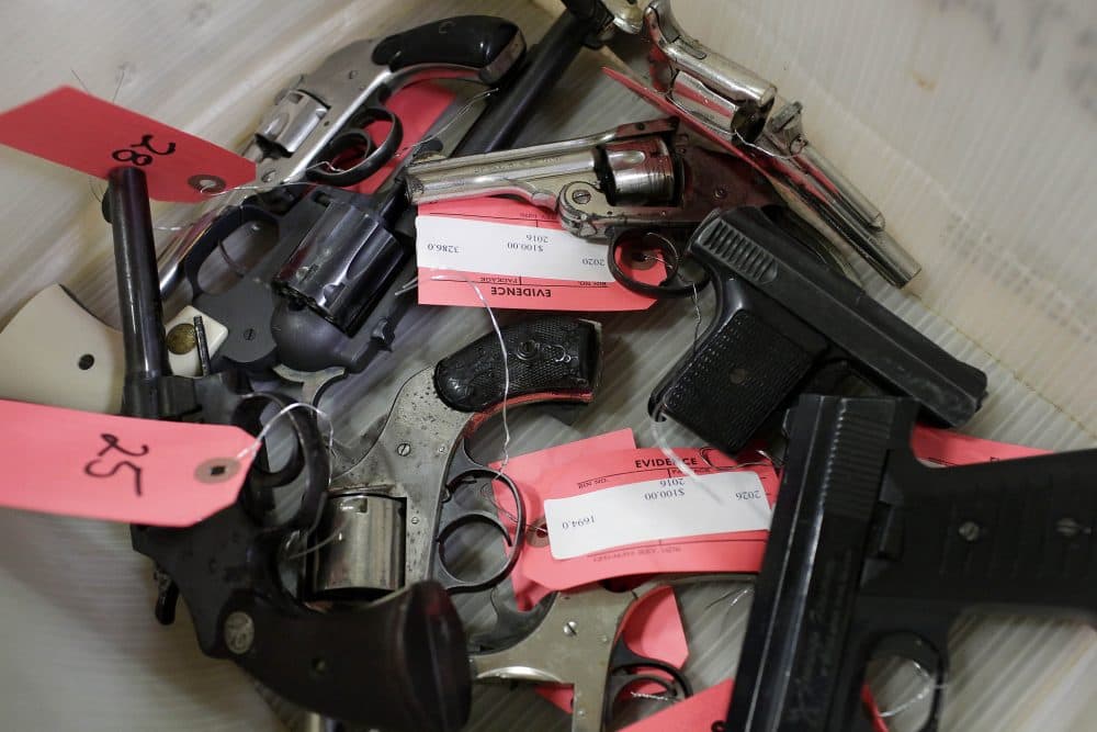 Handguns are seen in a bin during a Chicago Police Department gun turn-in event at Uptown Baptist Church, Nov. 19, 2016, in Chicago. (Joshua Lott/AFP/Getty Images)