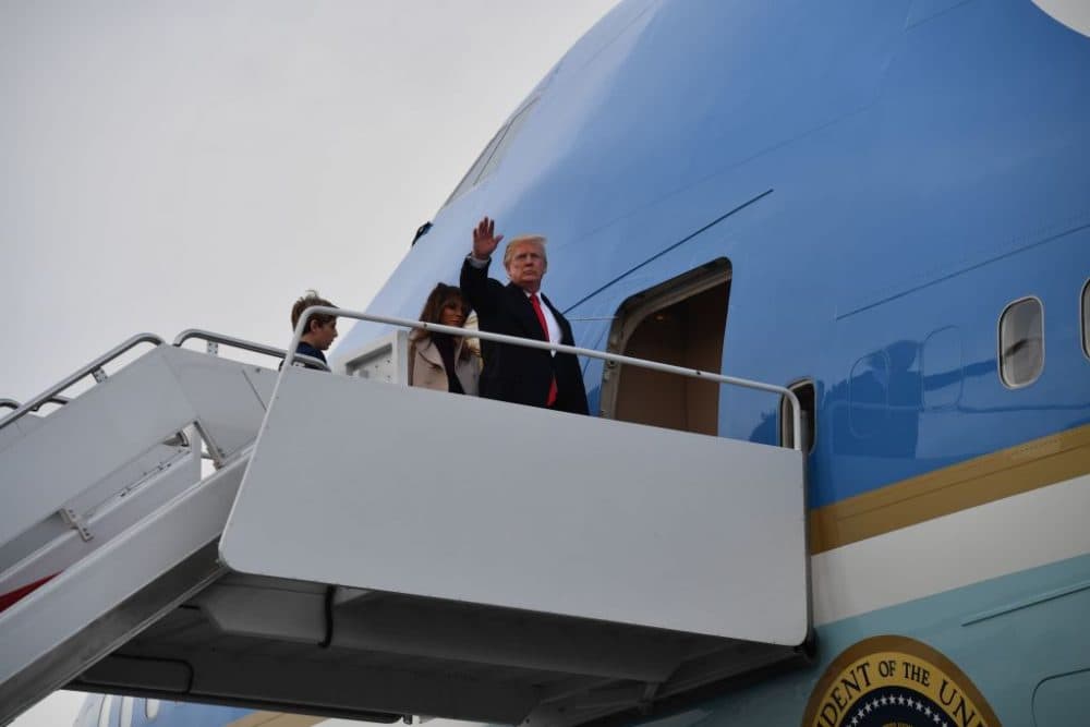 President Trump boards Air Force One in West Palm Beach, Fla., with first lady Melania Trump and son Barron Trump en route to Washington, DC on Jan. 1, 2018. (Nicholas Kamm/AFP/Getty Images)