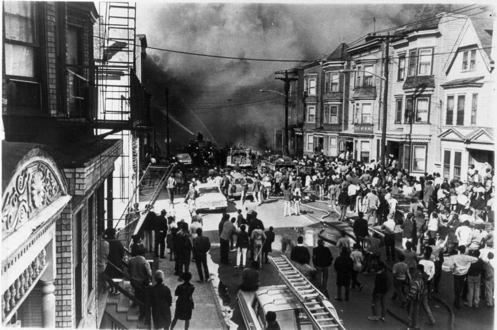 A Major fire in Newark, N.J., drew a large crowd of onlookers watching firemen pour water onto the burning building, April 6, 1968. City officials reported some firebomb incidents in response to the assassination of Martin Luther King Jr. in Memphis, Tenn. (AP Photo)