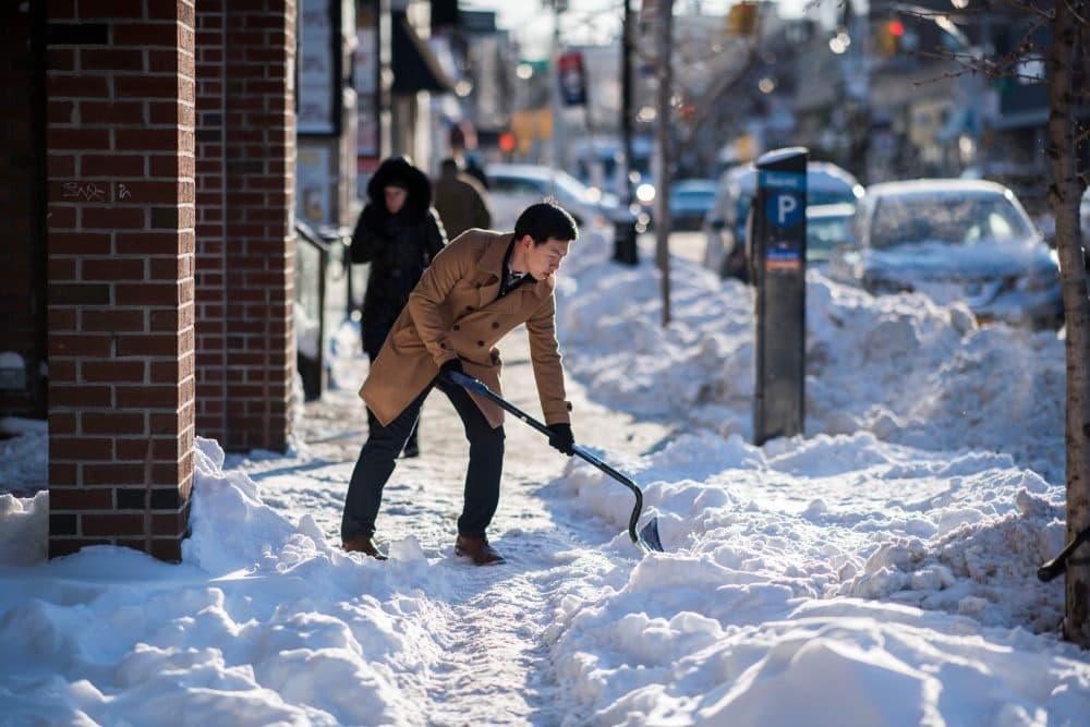 A man shovels snow from a footpath during a cold morning in New York on Jan. 5, 2018. (Jewel Samad/AFP/Getty Images)