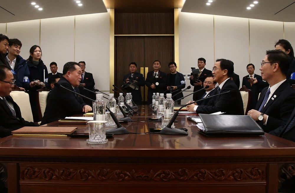 South Korean unification Minister Cho Myoung-Gyon (right) talks with the head of the North Korean delegation Ri Son-Gwon during their meeting at Panmunjom in the Demilitarized Zone on Jan. 9, 2018 in Panmunjom, South Korea. South and North Korea are scheduled to begin their first official face-to-face talks in two years on Tuesday, Jan. 9, 2017. (Korea Pool/Getty Images)