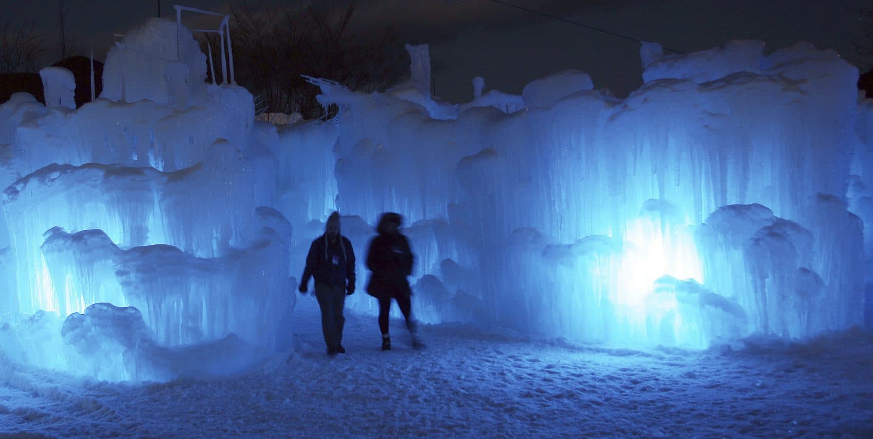 People tour an ice castle in Lincoln, New Hampshire in 2014. (Jim Cole/AP)