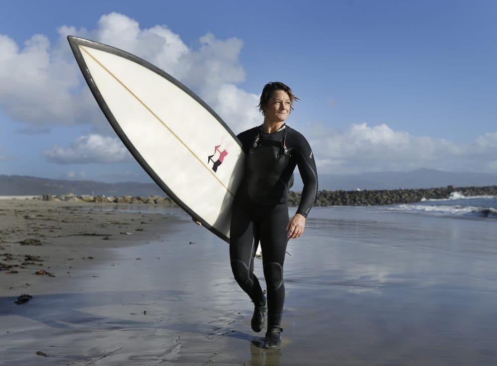 Bianca Valenti walks on the beach after surfing waves at Mavericks, Friday, Dec. 4, 2015, in Half Moon Bay, Calif. (Ben Margot/AP)