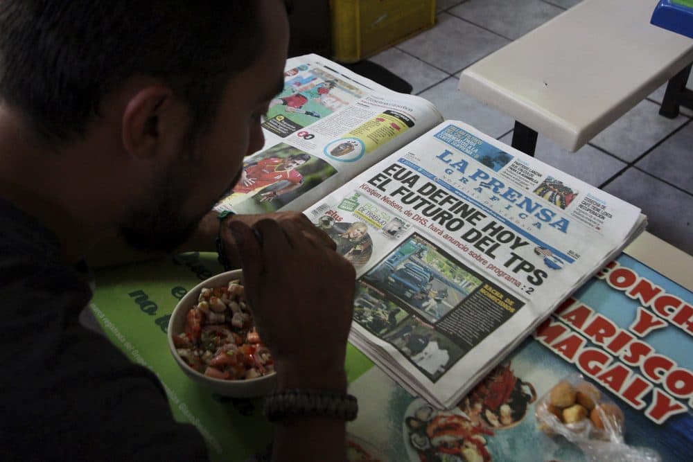 Mario Escalante reads a newspaper during lunch at a local market in San Salvador, El Salvador, Monday, Jan. 8, 2018. The U.S. administration announced that it will end the temporary protected status that has allowed some 200,000 people from El Salvador to stay legally in the United States for nearly 17 years, the Department of Homeland Security, DHS, said Monday. The newspaper headline reads in Spanish &quot;The United States will decide today the future of TPS.&quot; (Salvador Melendez/AP)