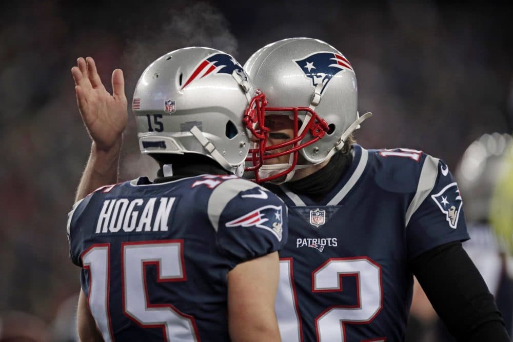 New England Patriots quarterback Tom Brady celebrates his touchdown pass to Chris Hogan during the first half of the AFC divisional game against the Tennessee Titans on Saturday. (Charles Krupa/AP)