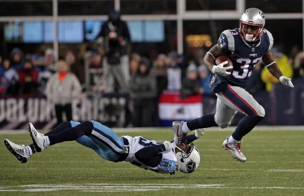 New England Patriots running back Dion Lewis, right, eludes Tennessee Titans cornerback Tye Smith during the first half of an NFL divisional playoff football game, Saturday, Jan. 13, 2018, in Foxborough, Mass. (Steven Senne/AP)