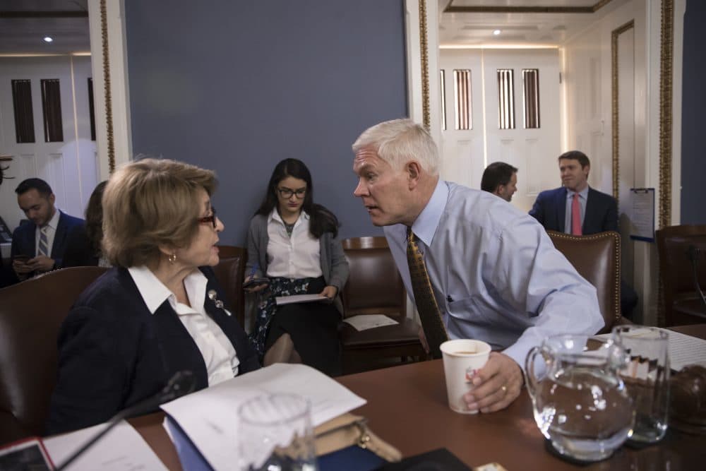 House Rules Committee Chairman Pete Sessions, R-Texas, center, confers with Rep. Louise Slaughter, D-N.Y., the top Democrat, as the panel meets on Capitol Hill in Washington, Thursday, Dec. 21, 2017. (J. Scott Applewhite/AP)