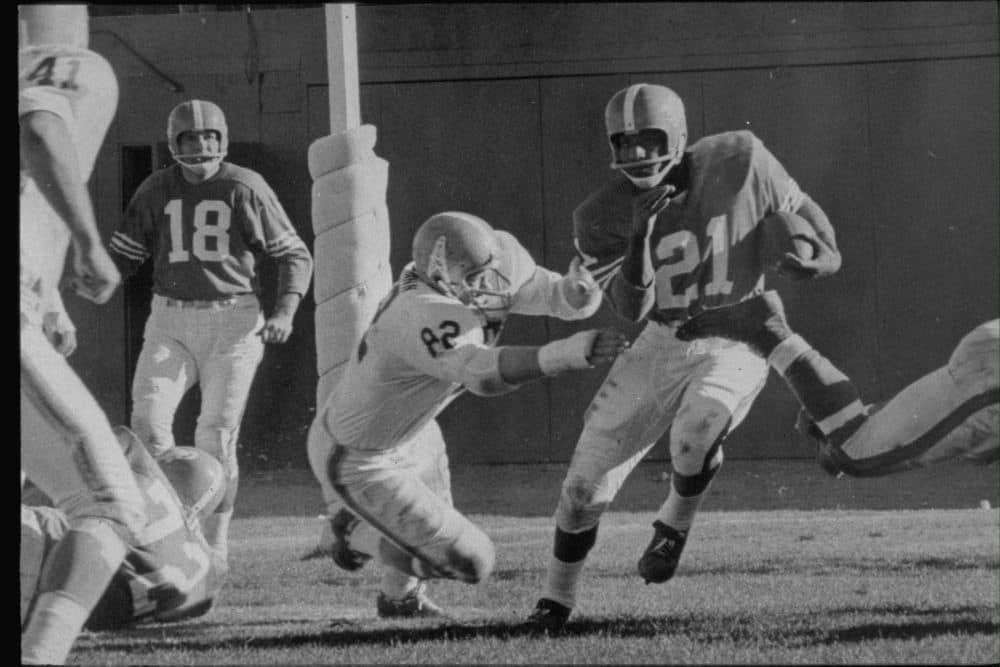 Gene Mingo (center), pictured here in 1962 on the Denver Broncos, quit football just over a week after he began playing as a kid. But he found his way back to the sport, which would impact his life in as many ways off the field as it would on the field. (Courtesy Denver Broncos)