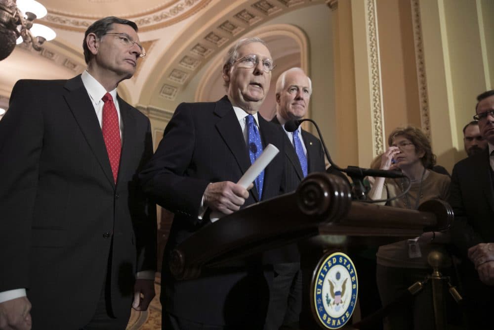 Senate Majority Leader Mitch McConnell, R-Ky., flanked by Sen. John Barrasso, R-Wyo., left, and Majority Whip John Cornyn, R-Texas, speaks to reporters about efforts to avoid a government shutdown this weekend, at the Capitol in Washington, Wednesday, Jan. 17, 2018. (J. Scott Applewhite/AP)