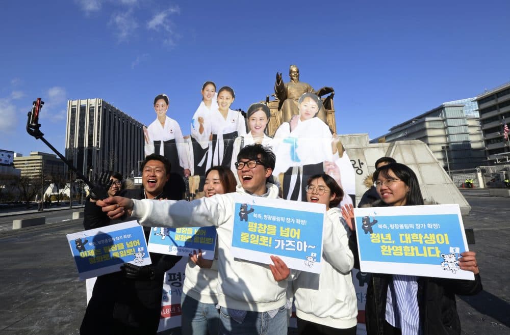 College students take a selfie with cutouts of North Korean cheerleaders during a rally to welcome the outcome of a meeting between South and North Korea, in Seoul, South Korea, Wednesday, Jan. 10, 2018. South Korea's president said Wednesday he's open to meeting with North Korean leader Kim Jong Un if certain conditions are met, as he vowed to push for more talks and cooperation with the North to try to resolve the nuclear standoff. The letters read: &quot;We welcome the attendance of North Korea at the Pyeongchang Winter Olympics.&quot; (Ahn Young-joon/AP)
