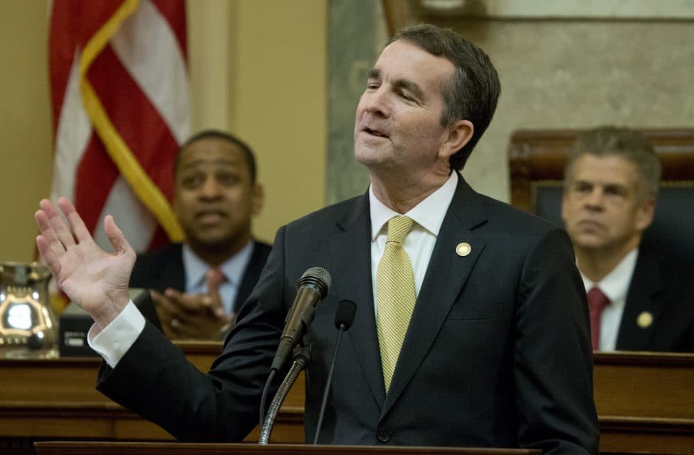 Virginia Gov. Ralph Northam gestures as he delivers his State of the Commonwealth address before a joint session of the Virginia General Assembly as Lt. gov. Justin Fairfax, left, and House Speaker Kirk cox, R-Colonial Heights, right, listen at the Capitol in Richmond, Va., Monday, Jan. 15, 2018. (Steve Helber/AP)
