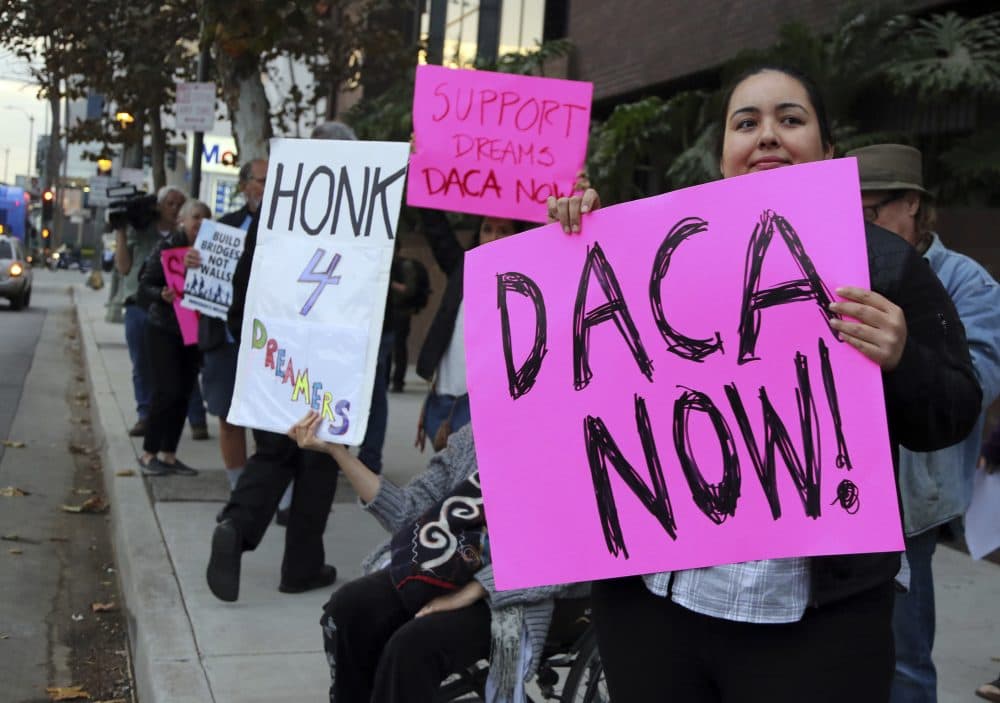 Demonstrators urging the Democratic Party to protect the Deferred Action for Childhood Arrivals Act (DACA) rally outside the office of California Democratic Sen. Dianne Feinstein in Los Angeles Wednesday, Jan. 3, 2018. (Reed Saxon/AP)