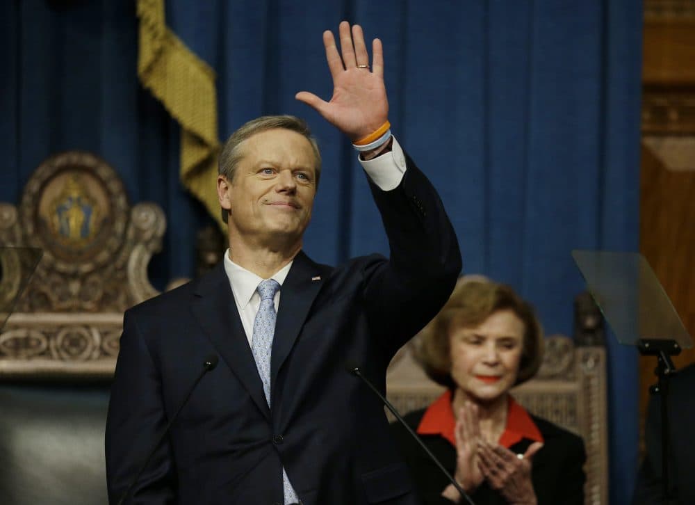 Gov. Charlie Baker waves to those in attendance before he delivers his State of the Commonwealth address in the Massachusetts House Chamber on Tuesday in Boston. (Stephan Savoia/AP)