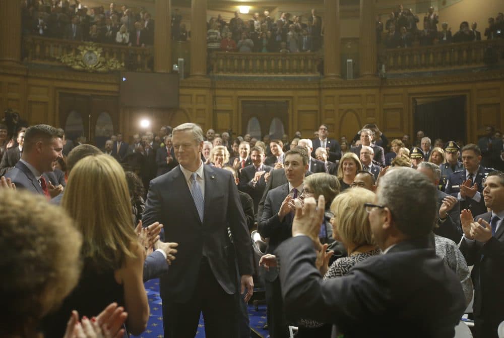 Gov. Charlie Baker enters the House Chamber before he delivers his state of the state address in the Massachusetts House Chamber on Tuesday. (Stephan Savoia/AP)