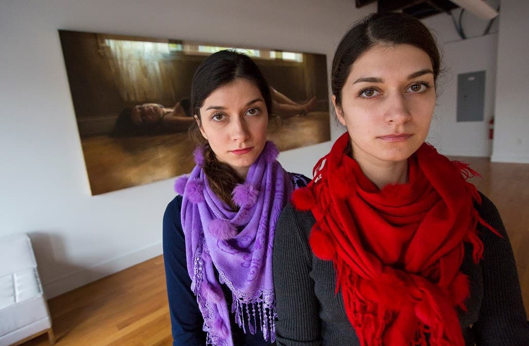 Bahareh (left) and Farzaneh Safarani in the gallery space at Amalgam. (Jesse Costa/WBUR)