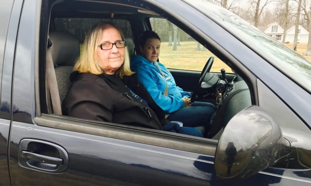 Heather Adams and Gloria Hollifield waiting to pick up their children after the shooting. (Nicole Erwin/Ohio Valley ReSource)